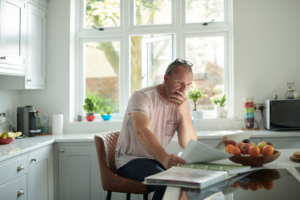 Man reviewing finances at table
